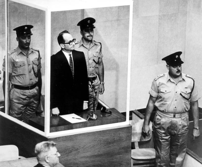 Former Nazi SS Officer Adolph Eichmann stands in his glass cage in the Israeli Supreme Court here today, as the court's president, Jusrice Shimon Agranat announces that his appeal against the death sentence is to be upheld. Eichmann, 56, had appealed against the sentence of death imposed on him by the Jerusalem district court last December when he was found guilty of his part in Nazi germany's sla