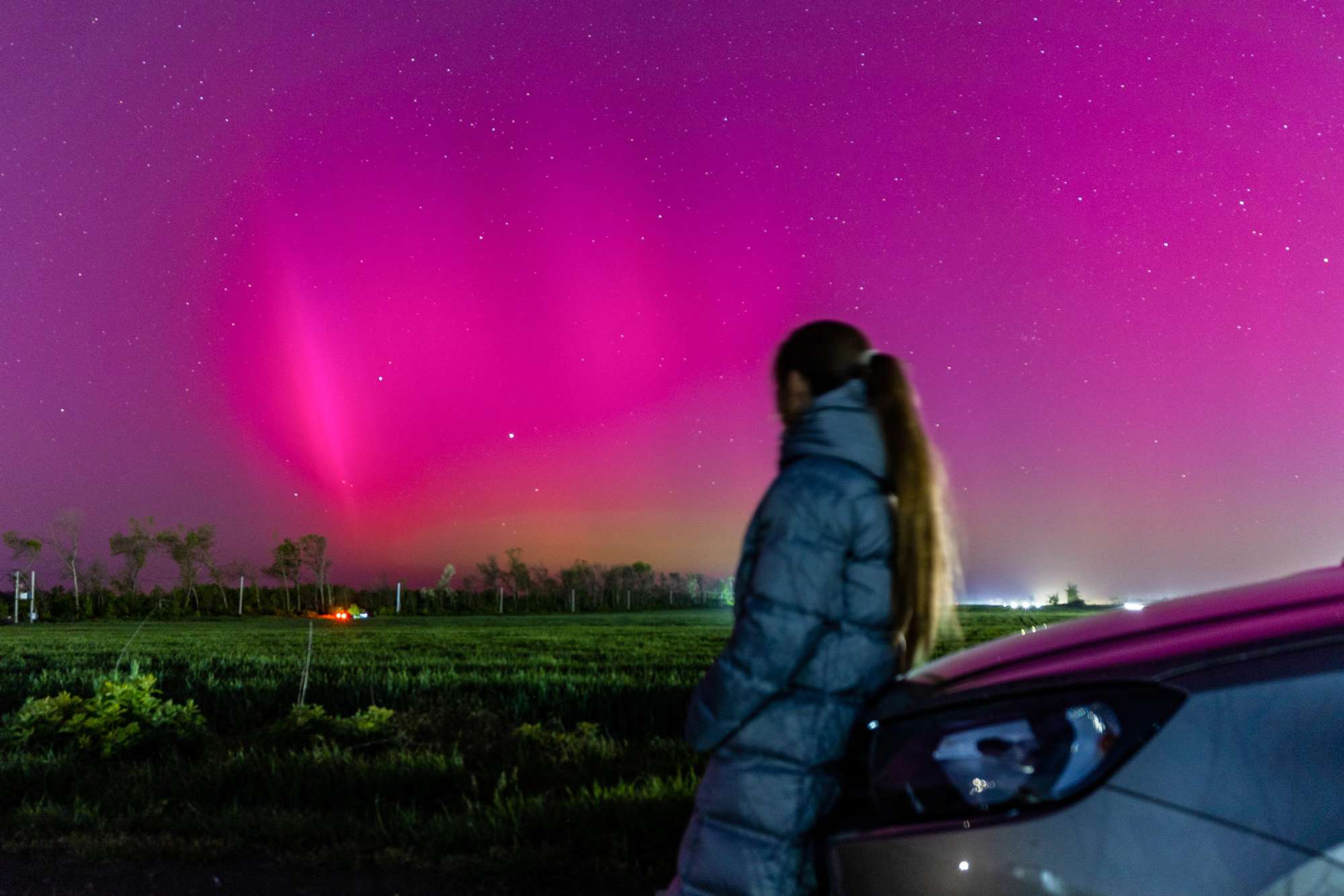 RUSSIA, ROSTOV-ON-DON - MAY 10, 2024: A woman admires the Northern Lights in southwest Russia. The natural phenomenon was caused by a massive geomagnetic storm which started on 10 May. Erik Romanenko/TASS/Sipa USA
